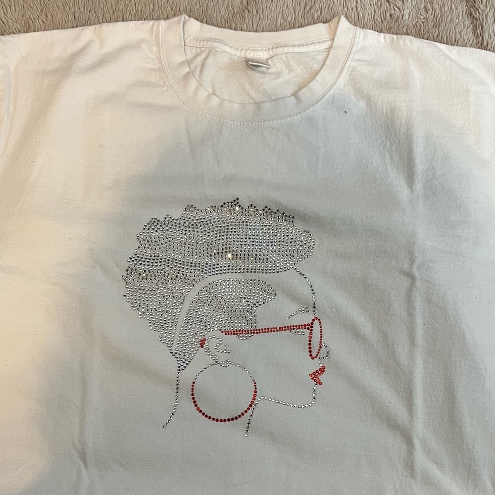 White T-shirt, casual with rhinestones.